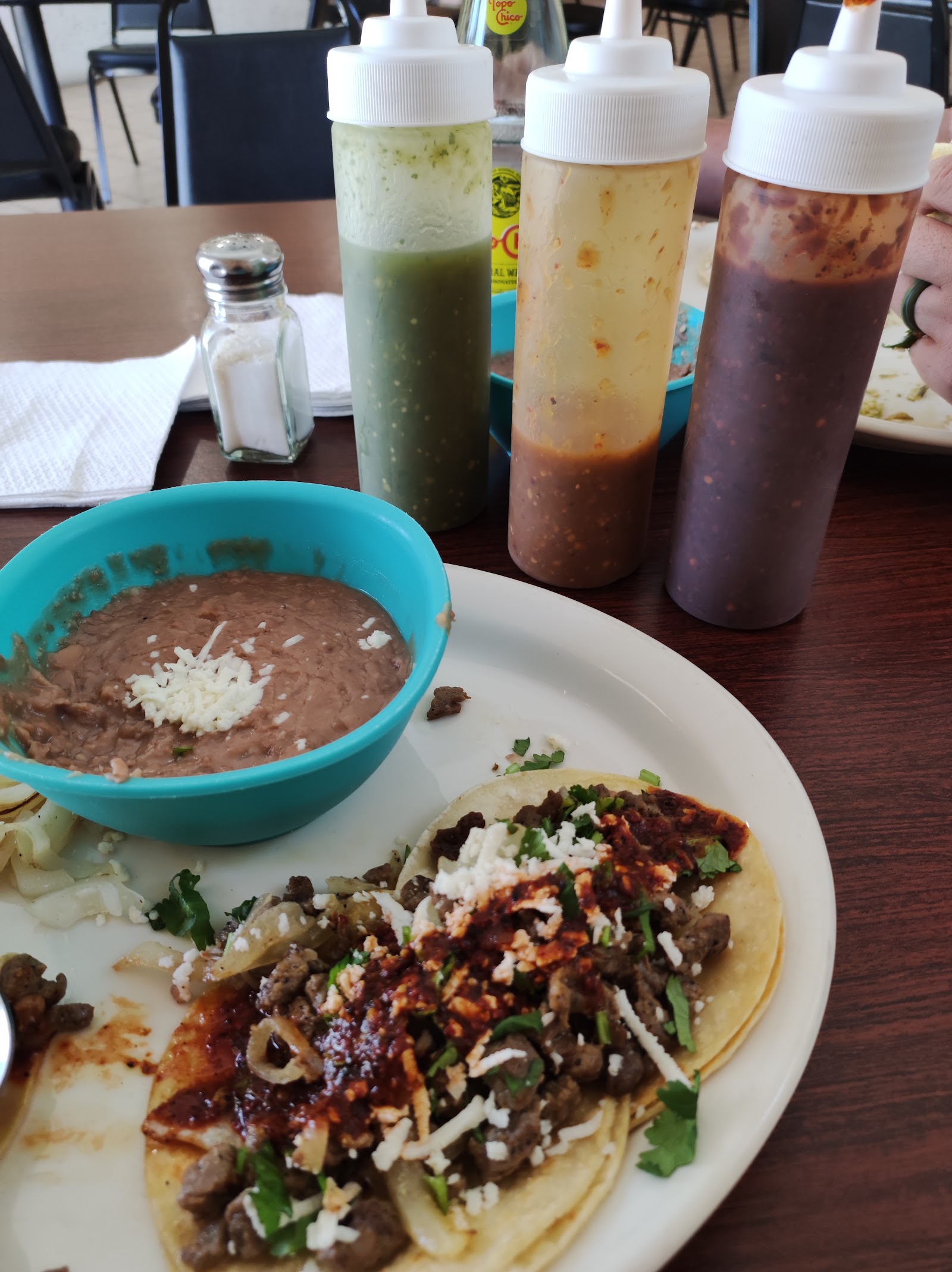 Plated tacos with fresh salsa at Tacolicious